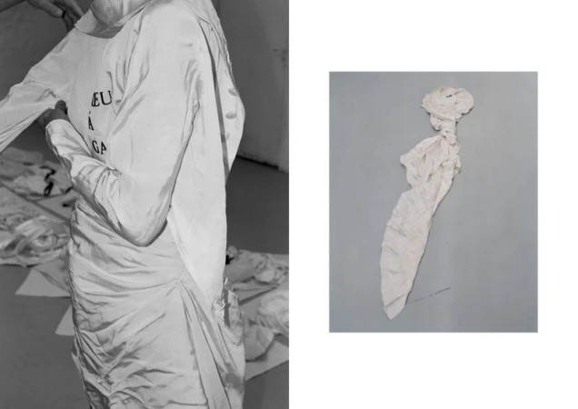Fashion photography featuring a model being dressed in a white dress with text, accompanied by a crumbled dress on a gray background.