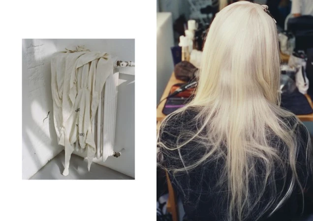 Back view of a person with blonde hair sitting in a room with assorted items and radiator in the background, showcasing a candid scene.