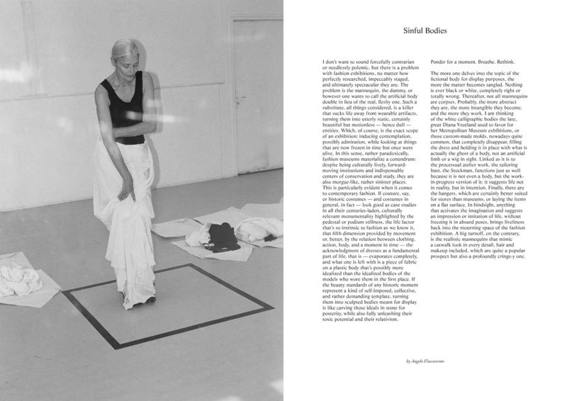 Monochrome image features a woman standing near fabric in an indoor setting, next to pages of text, surrounded by a dark square outline.