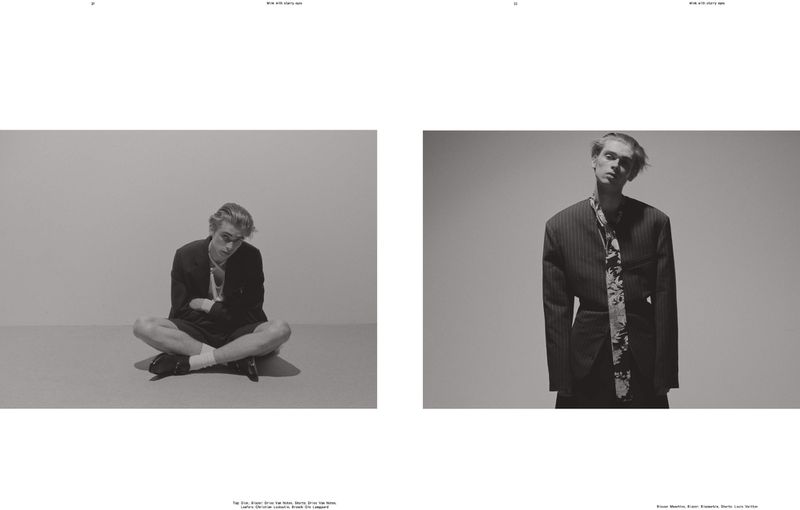 Editorial spread in black and white featuring a seated model cross-legged on the left and a standing model wearing a blazer on the right.