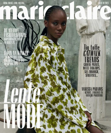 Marie Claire magazine cover featuring an African-American female model wearing a floral print jacket, with a classical statue in the background.