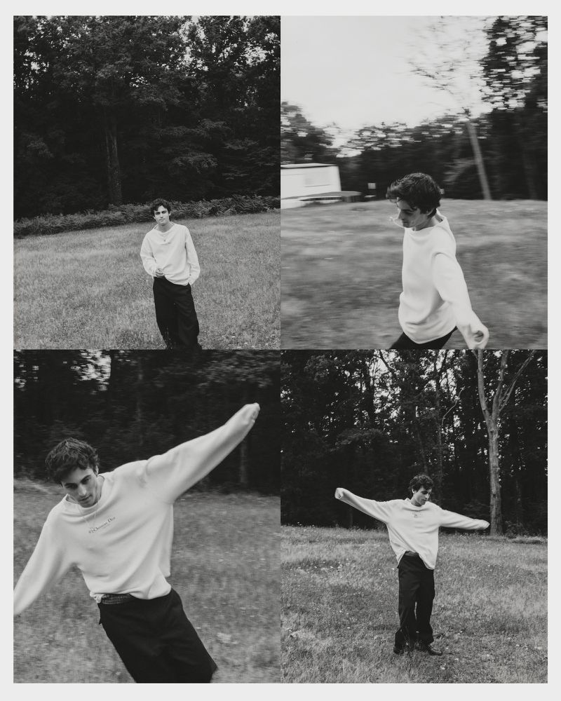 Monochrome four-panel editorial grid of Julien de Saint Jean moving playfully across a grassy field in a white sweater and black trousers.
