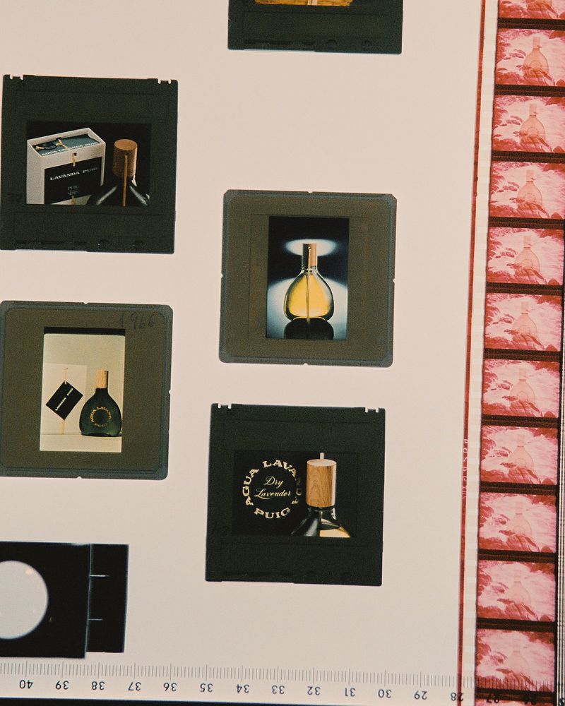 Promotional slides featuring perfume bottles in various shapes and designs, captured in a studio setting with controlled lighting.