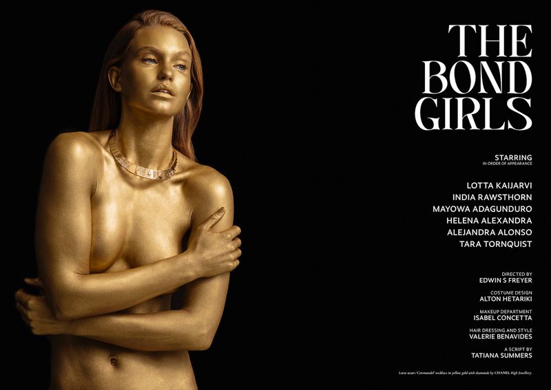 Golden-skinned woman with necklace poses against black backdrop near white text overlay for 'The Bond Girls' fashion or beauty ad.