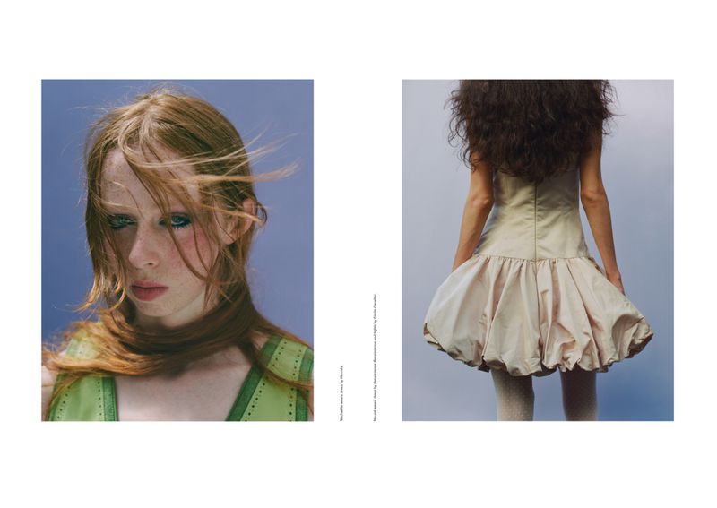 Fashion editorial shot featuring a red-haired woman in green dress and a woman with dark curly hair in a beige dress.