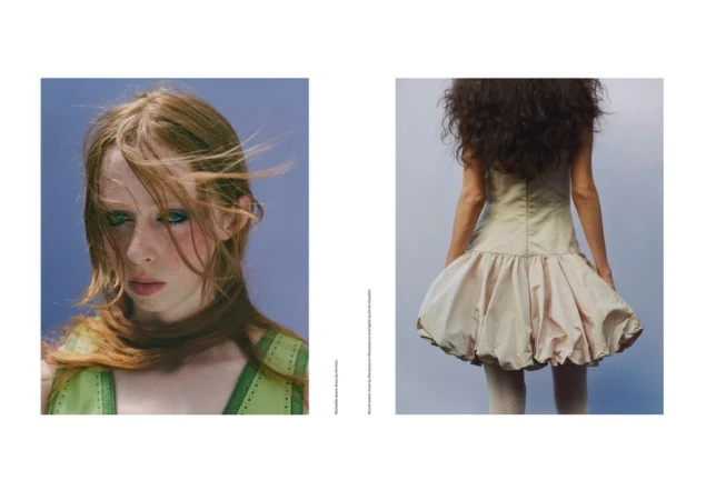 Fashion editorial shot featuring a red-haired woman in green dress and a woman with dark curly hair in a beige dress.