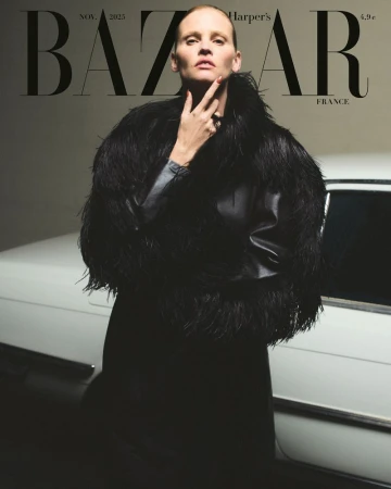 Bazaar France cover featuring a woman in a black jacket with feathered trim posing in front of a classic white car, November 2023.