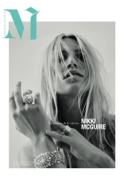 Model Nikki Mcguire wearing statement diamond rings and bracelet with hair across her face for M Revista de Milenio