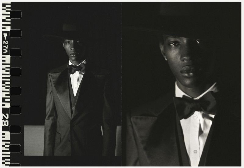 Monochrome portrait of an African American male in a dark suit, bow tie and hat. Filmstrip border on the left adds an artistic touch.