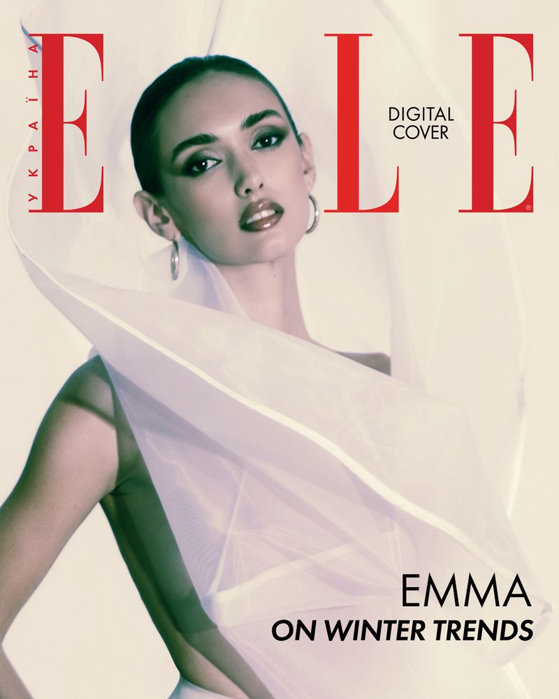 Elle magazine cover featuring a woman with dark hair wearing hoop earrings and a white garment against a white background.