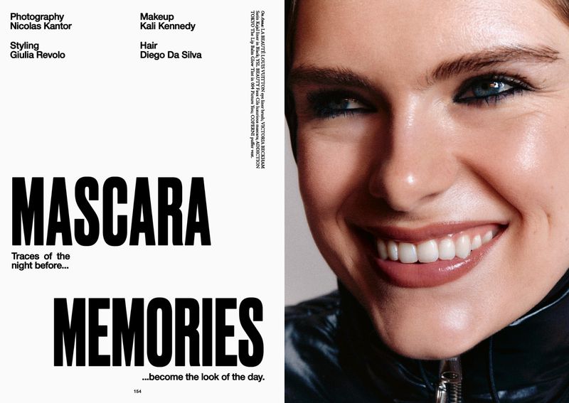 Close-up shot of a woman with glossy lips and dark eye makeup, featured in a beauty advertisement alongside bold text elements.
