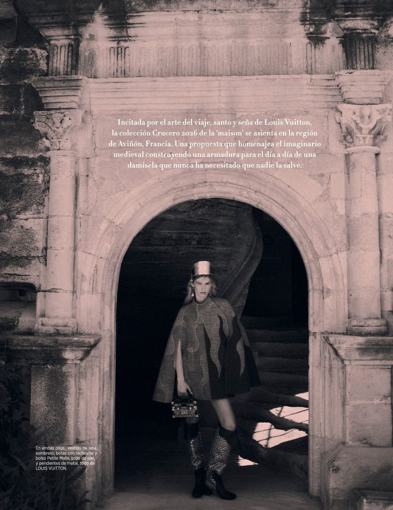 Fashion shoot featuring a model in a cape and thigh-high boots posing in a stone archway with a winding staircase in the background.