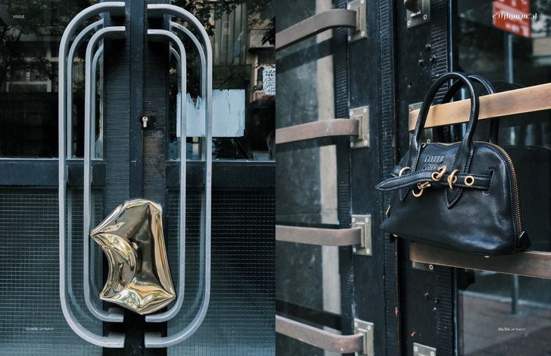 Black leather purse on a metal door, showcasing fashion accessory with architectural backdrop and natural lighting, reflecting urban style.