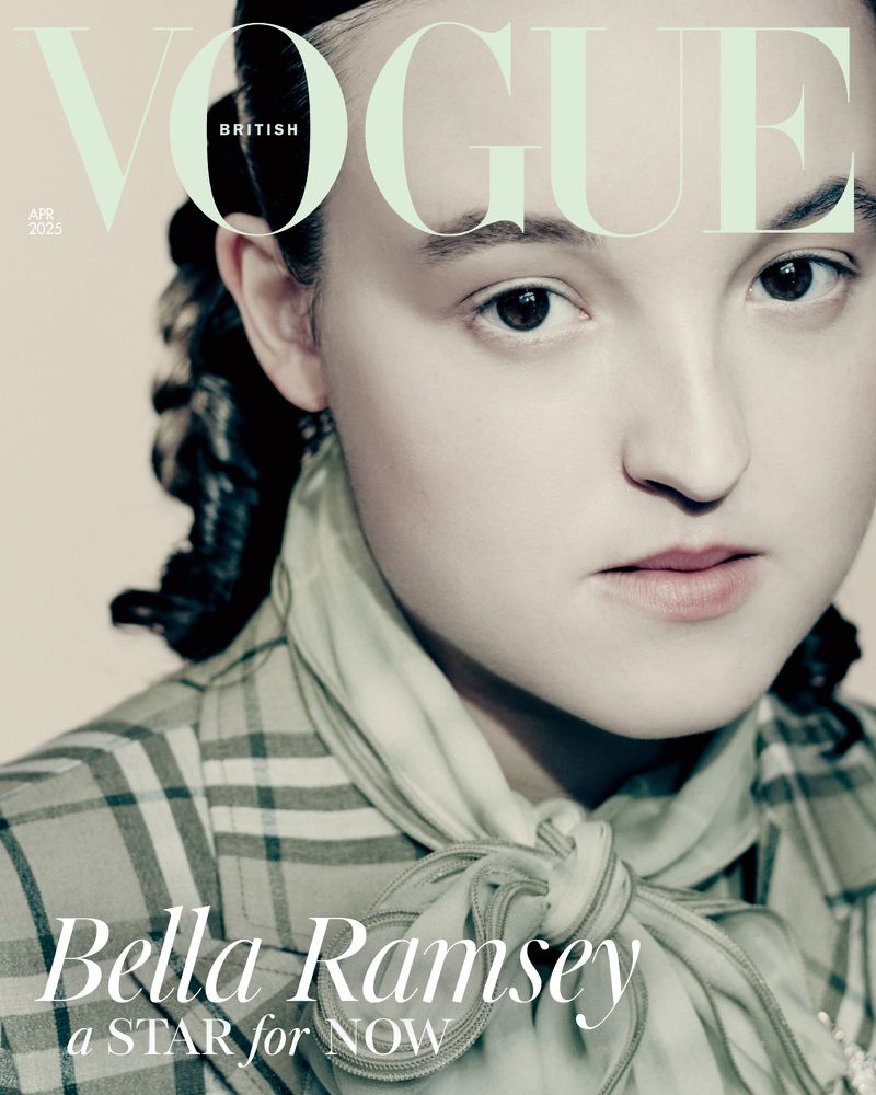 Portrait of Bella Ramsey on the cover of British Vogue magazine. She wears a plaid top and light green scarf against a beige background.