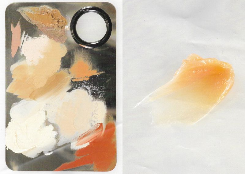 Cosmetic palette with foundation shades and swatch of cream highlighter on white background. Beauty product presentation, neutral tones.