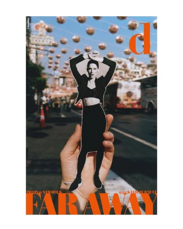 Fashion magazine cover featuring an adult female model in a cutout image against a city street backdrop with decorative lanterns.