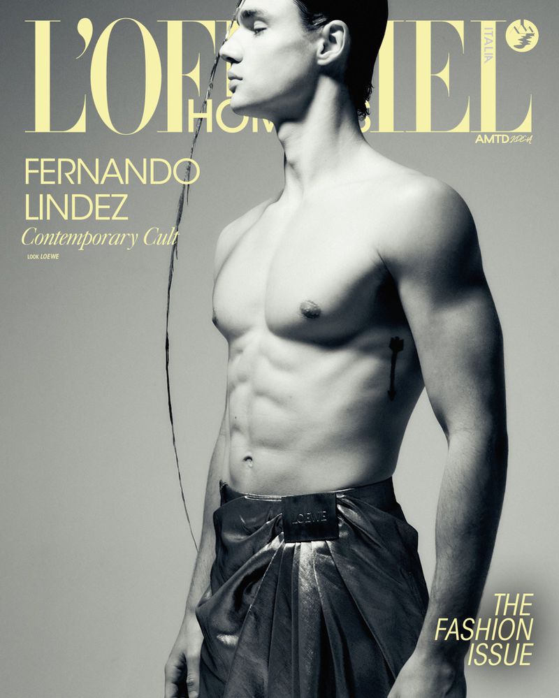 Fashion magazine cover featuring a shirtless male model, Fernando Lindez, in a studio setting, showcasing the 'Fashion Issue' focus.