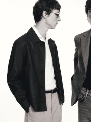 Two male models in professional menswear posing against a seamless white background for Massimo Dutti
