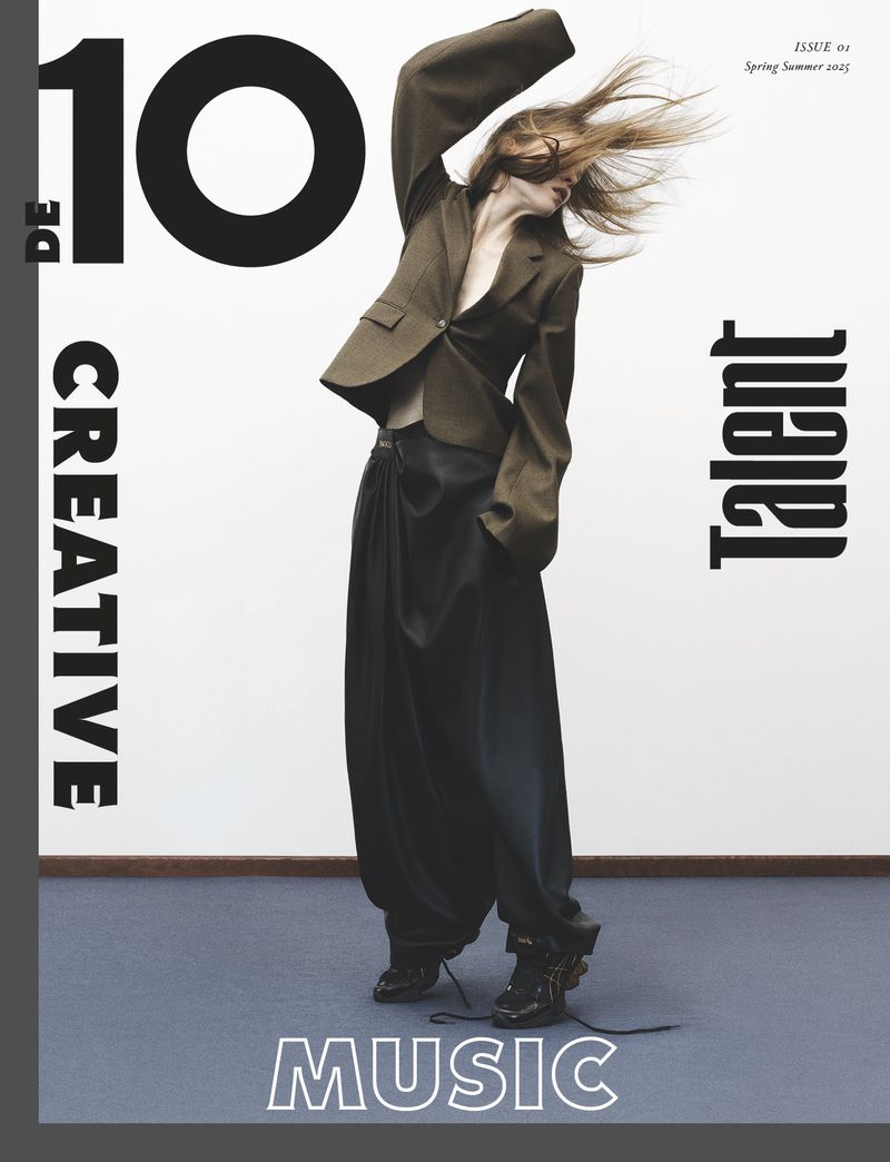 Magazine cover featuring a stylish woman in an oversized blazer and loose black pants, with bold typography: '10 DE Creative Talent Music'.