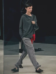 Model walking on runway wearing a grey cashmere sweater and trousers for Massimo Dutti Cashmere Pre Fall special