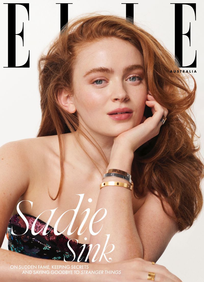 Magazine cover featuring Sadie Sink with red hair and natural makeup, wearing a strapless top with sequins. Elle Australia masthead visible.
