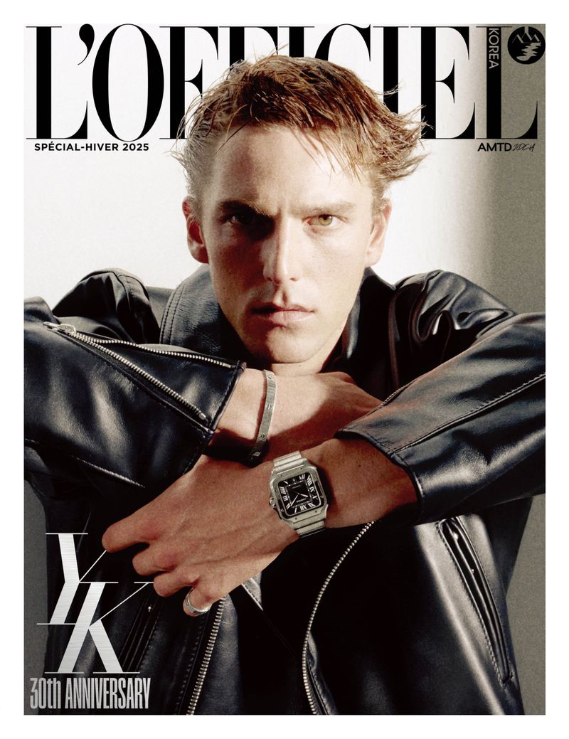 Magazine cover featuring a handsome blond male model wearing a leather jacket, bracelet and watch, with L'Officiel Korea masthead.