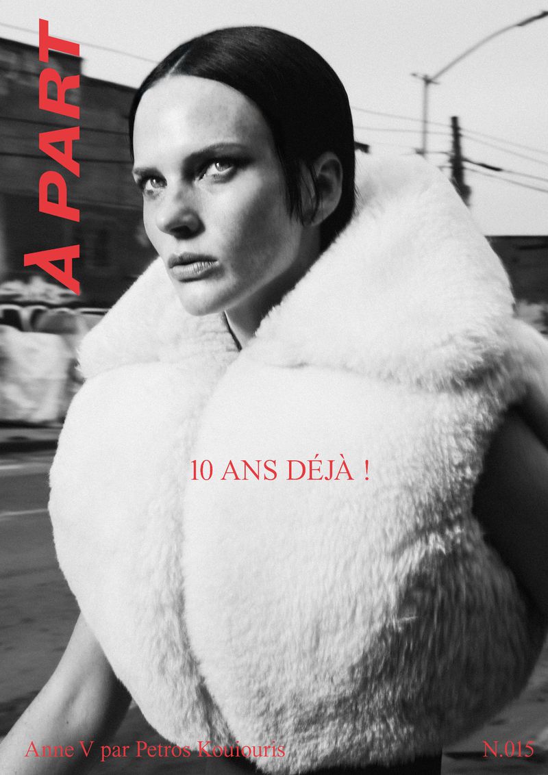 Monochrome fashion shot of a woman in a fur vest, staring intently with red text overlay and urban background creating a stark contrast.