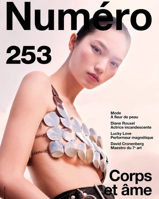 Magazine cover featuring an Asian model with silver body jewelry. The cover includes the magazine's name, edition number, and text in French.