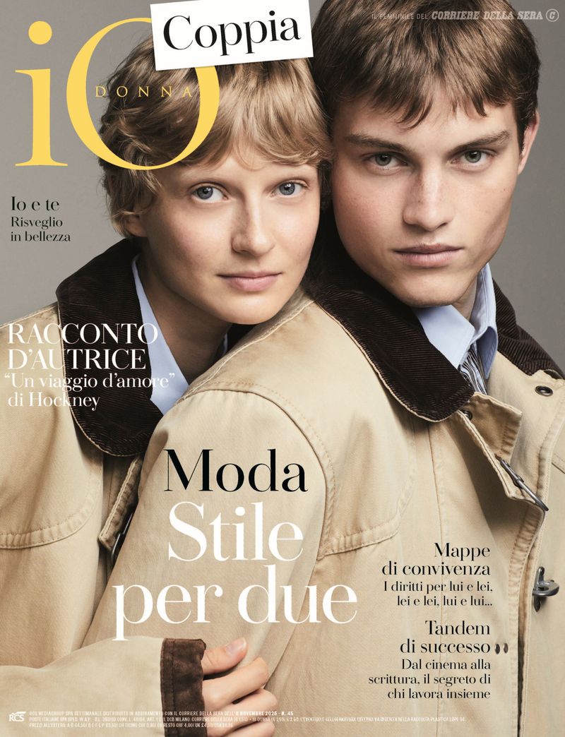 Magazine cover featuring a young couple embracing. The woman has blond hair and the man has brown hair. They wear matching tan jackets.