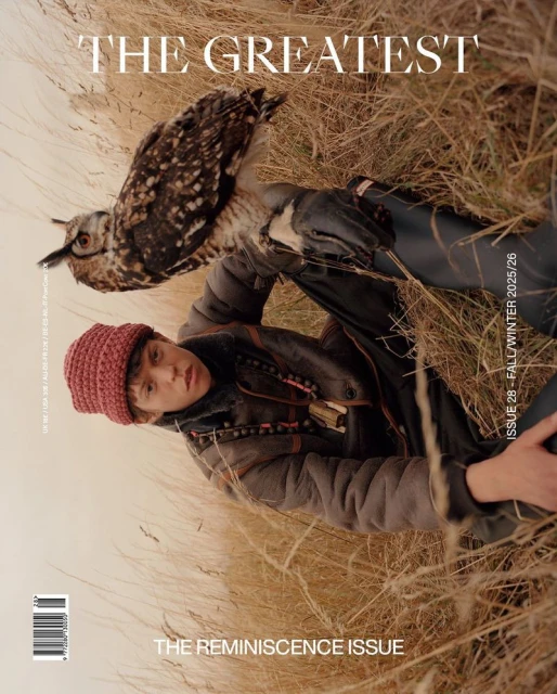 Magazine cover featuring a person in outdoor apparel with an owl perched on their arm, set against a backdrop of dry grass.
