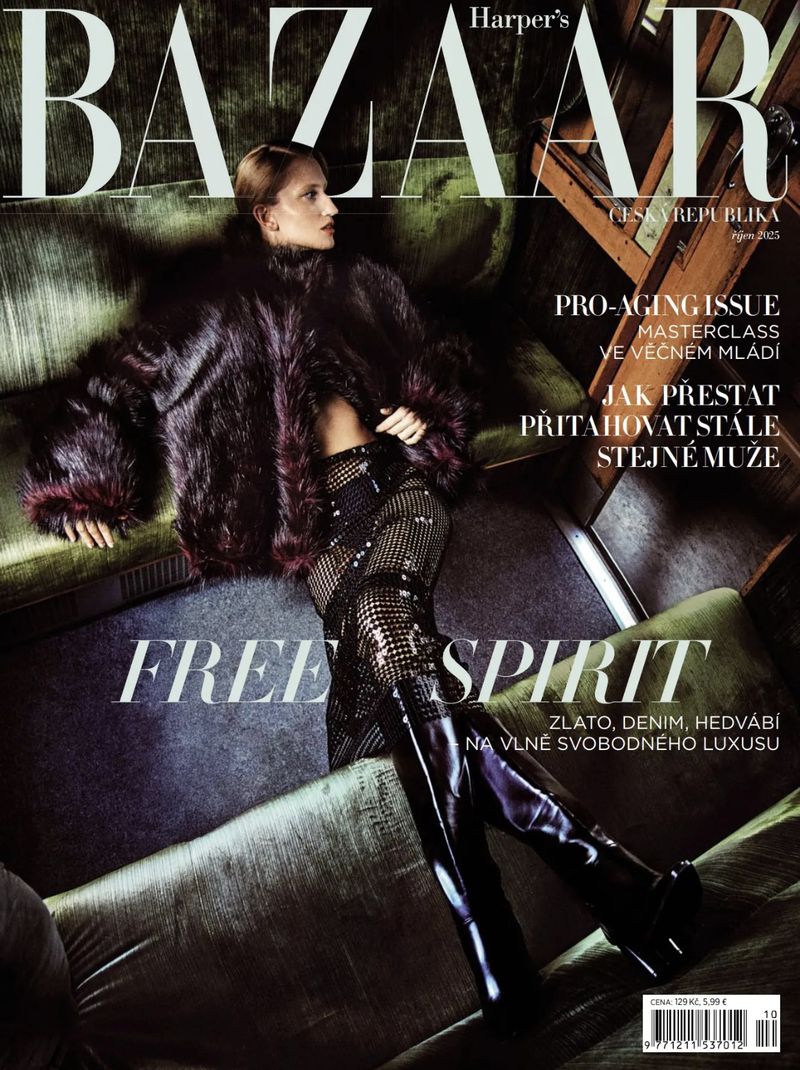Magazine cover featuring a model lying on a green sofa, wearing a fur coat and sparkly boots, with 'BAZAAR' and 'FREE SPIRIT' text.