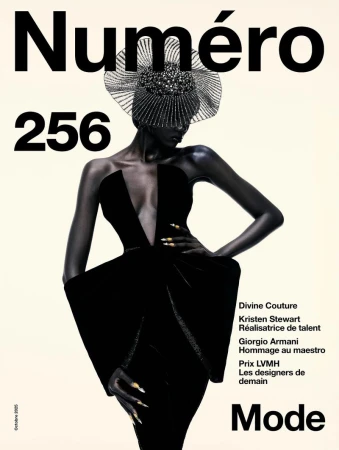A fashion magazine cover features a model in a black dress and headpiece against a cream background, with bold magazine text.