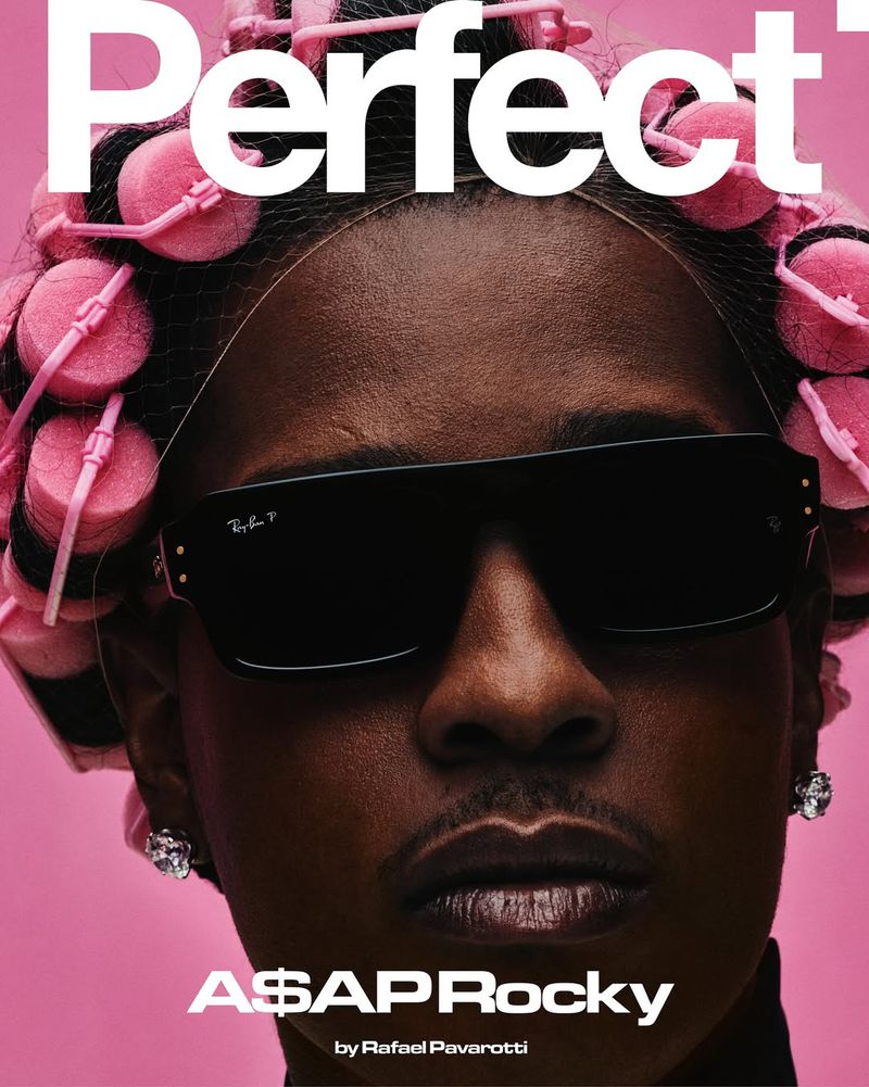 Magazine cover featuring A$AP Rocky with pink hair rollers and black sunglasses against a pink background, photographed by Rafael Pavarotti.