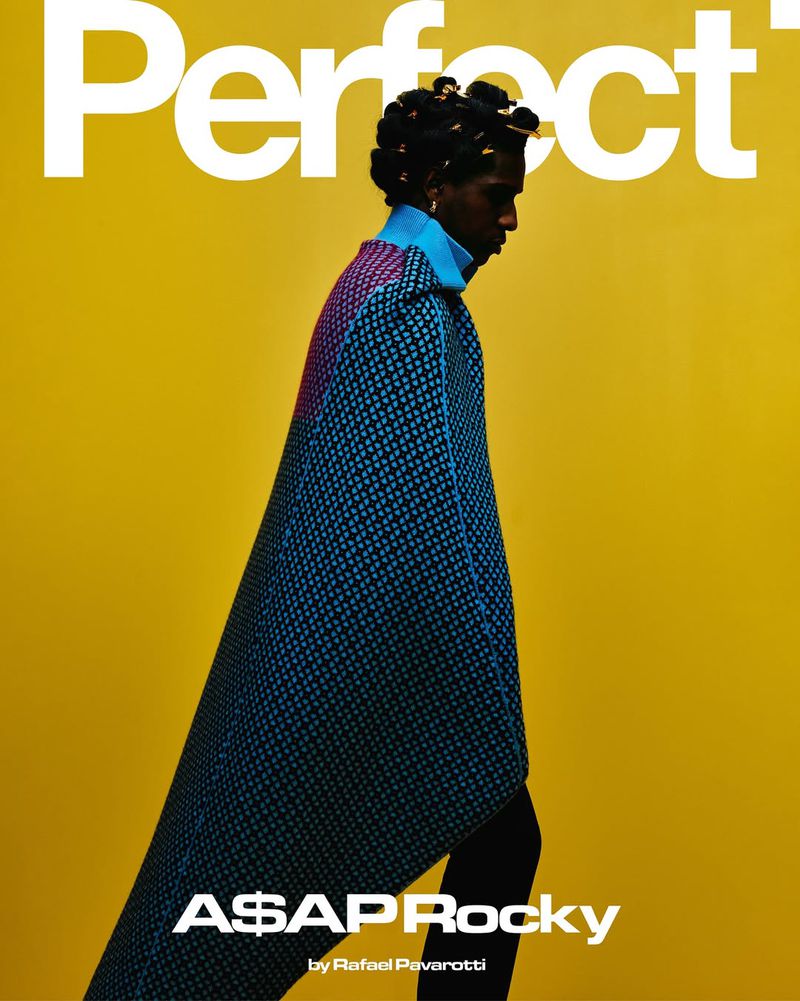 A$AP Rocky cover for Perfect magazine. The adult male is posing in profile, wearing a patterned blue cape against a yellow background.