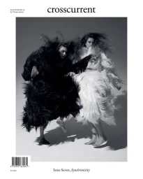 Two models posing in mid-air wearing dynamic black and white feathered garments on the cover of Crosscurrent magazine.