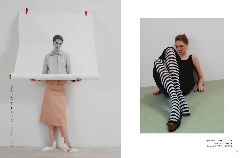 A model poses holding a paper with a black and white image, and another model sits with striped tights. Fashion editorial.
