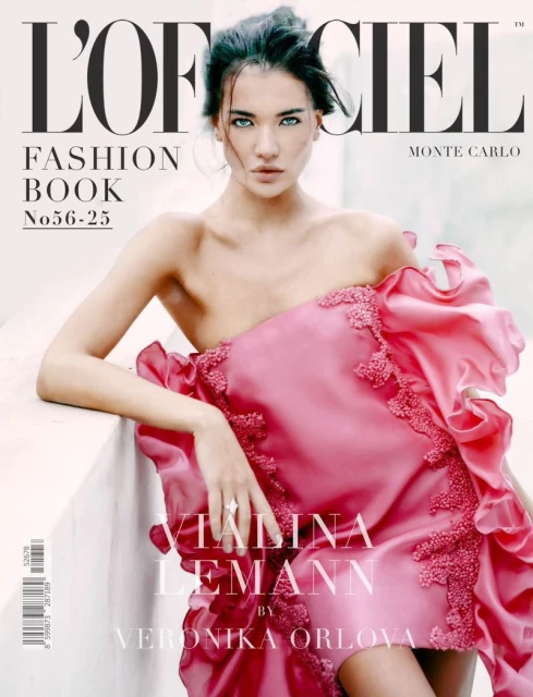 Magazine cover featuring a young adult woman with dark hair wearing a pink dress with lace details, posing against a neutral background.