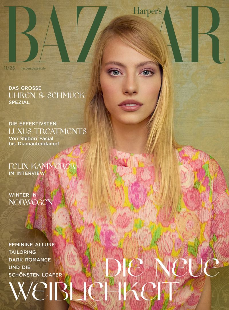 Harper's Bazaar cover featuring a blonde woman wearing a pink floral shirt, gazing at the camera against a light brown background.