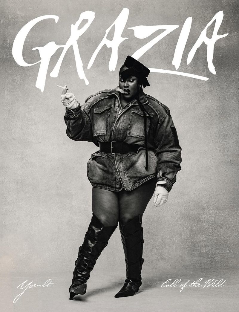 Black and white cover image of singer Yseult posing in a denim jacket and thigh-high boots for Grazia magazine