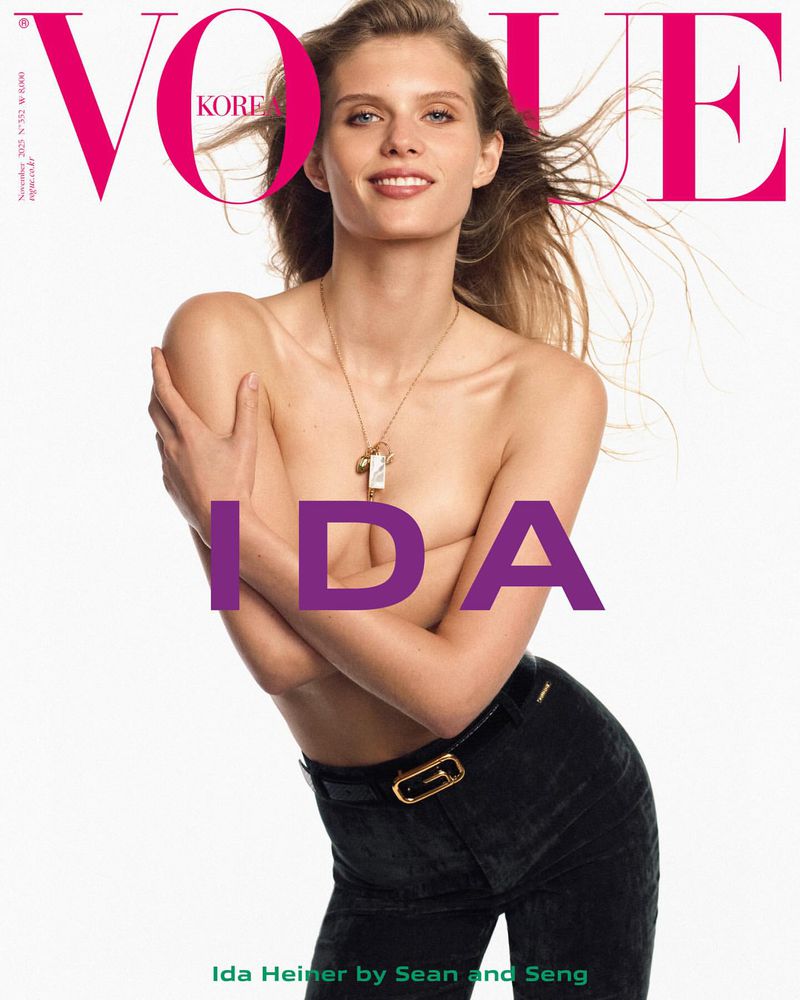 Vogue Korea magazine cover featuring adult female model, Ida Heiner, wearing black pants and a gold necklace on a white background.