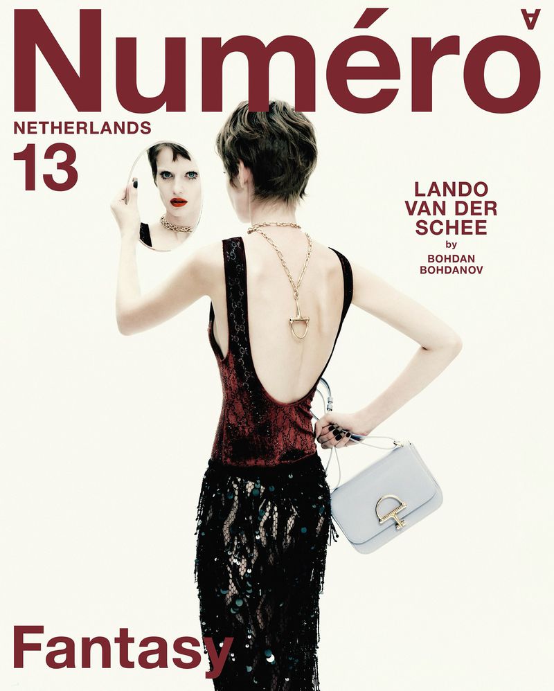 Model Lando van der Schee seen from behind holding a compact mirror showing her reflection on the Numéro Netherlands cover.
