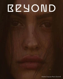 Close-up portrait of model Amelia Gray on the cover of Beyond Noise with dark hair strands framing her face, shot by Mario Sorrenti.