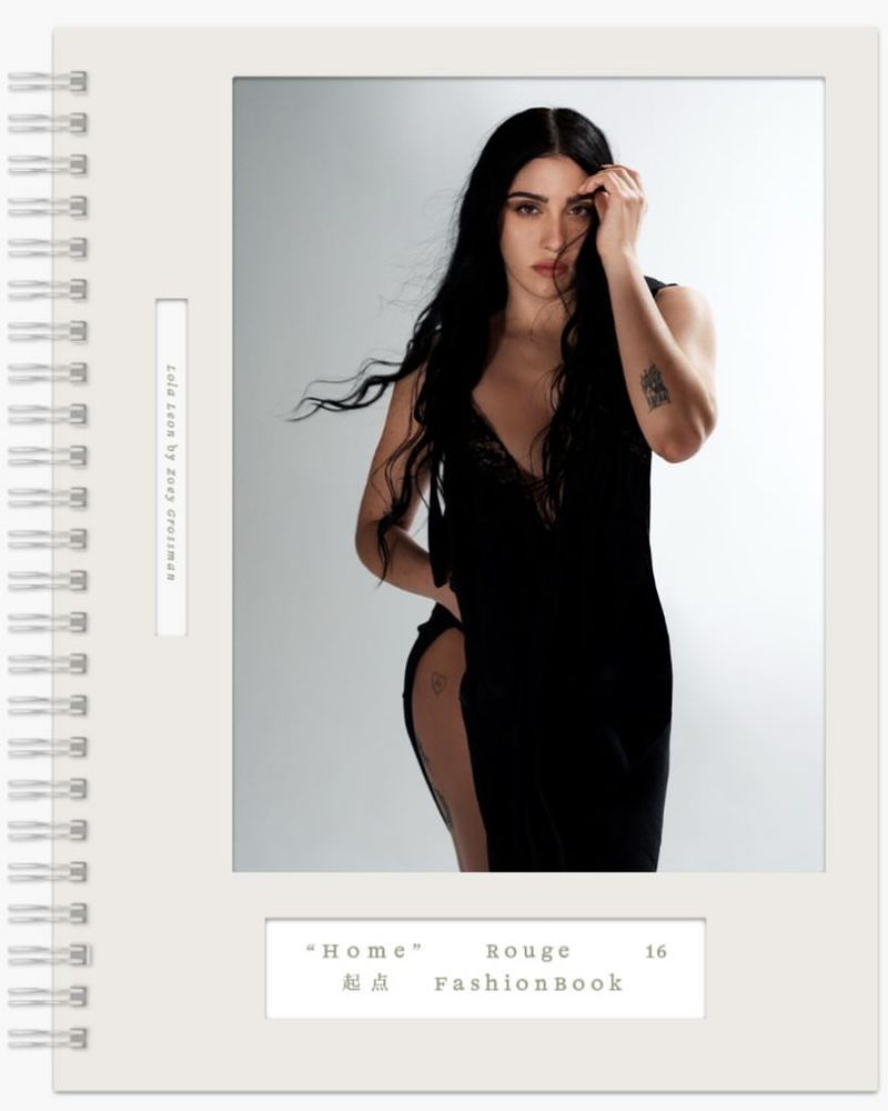 Fashion editorial featuring a woman with long black hair in a black dress, posing against a white backdrop with 'Home' text visible.