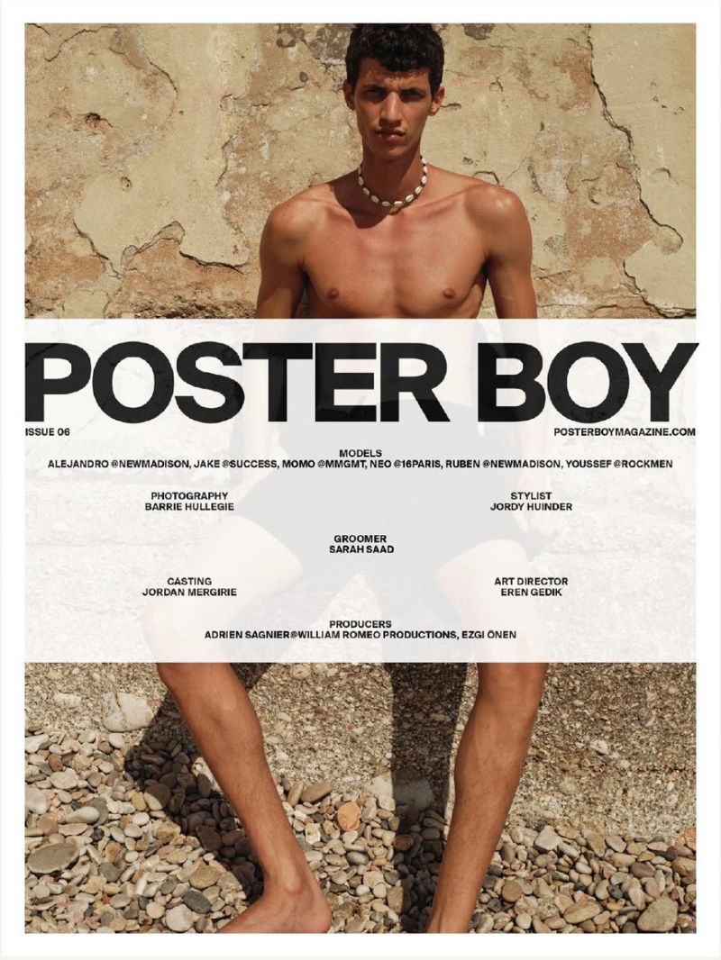 Poster Boy magazine cover features a topless male model wearing a necklace. The background includes a stone wall and a gravelly surface.
