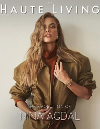 Model Nina Agdal wearing an olive jacket over a rust turtleneck against a plain background