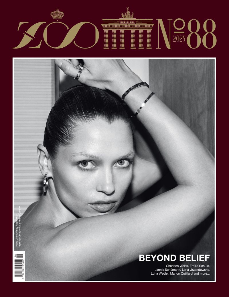 Black and white magazine cover featuring a portrait of a woman with jewelry and slicked-back hair, with the text 'BEYOND BELIEF'.