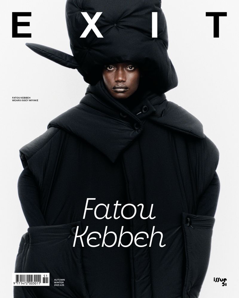 Fashion magazine cover features a model wearing an oversized black puffer coat and hat against a bright background with 'EXIT' text.