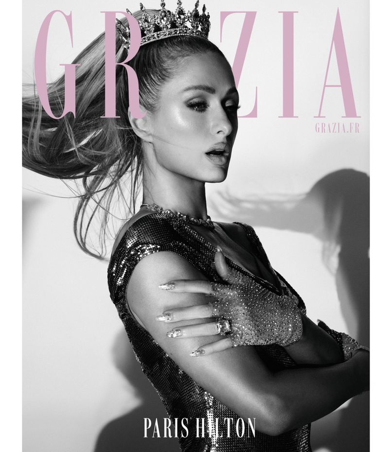 Black-and-white fashion magazine cover featuring Paris Hilton in a glittering outfit and crown, gazing off-camera with a Grazia masthead.