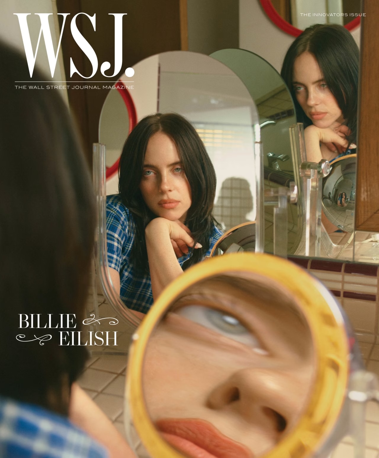 WSJ magazine cover featuring Billie Eilish looking at her reflection in multiple mirrors with a neutral facial expression.
