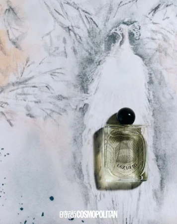 Rectangular glass perfume bottle with black spherical cap on a background with a white peacock illustration and grey watercolor splashes.